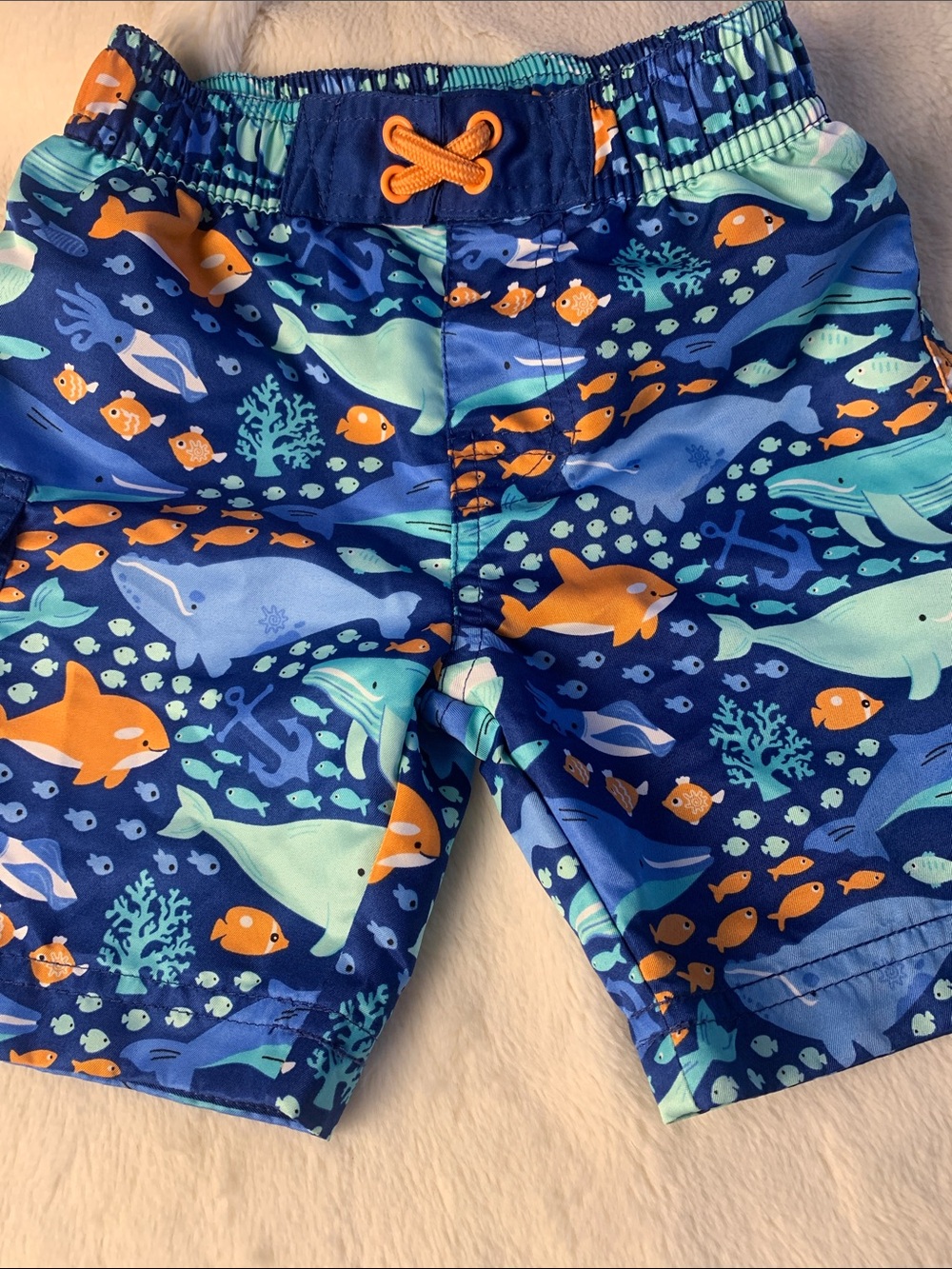 Blue Ocean Animal Print Kids Swim Shorts with Orange Accents